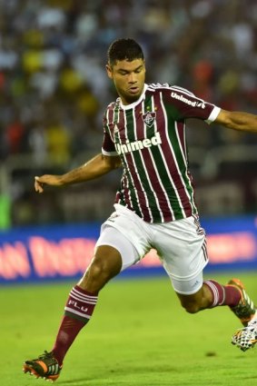 Italy's forward Ciro Immobile (right) attempts to get away from Fluminense defender Ailton during a friendly in Volta Redonda on Sunday.