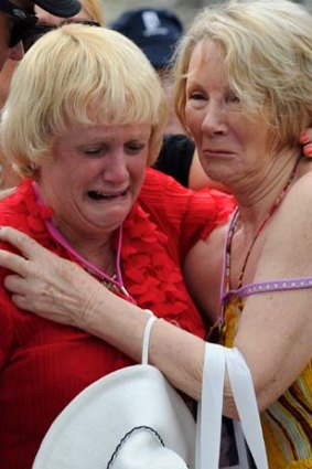 A little solace &#8230; Pauline Whitton, left, and Lynn Muller comfort each other at the memorial.