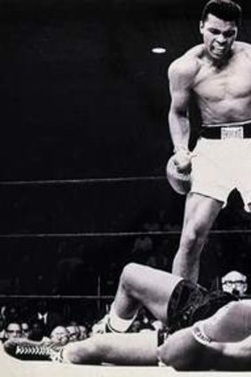Muhammad Ali stands over Sonny Liston.