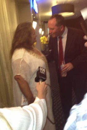 Mining magnate Gina Rinehart talks to Barnaby Joyce at his election function after he won the seat of New England for the Nationals.