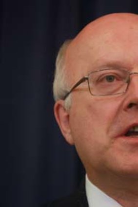 Outraged ... Senator George Brandis has labelled the dumping of Senator Crossin as discriminatory.