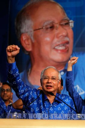 Malaysia's Prime Minister  Najib Razak celebrates his victory on election day.  Photo:  Getty Images