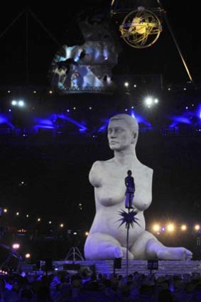 Bolshie brouhaha ... athletes and performers gather in the Olympic Stadium around a large-scale replica of Marc Quinn's controversial sculpture, <i>Alison Lapper Pregnant</i>. Lapper was born without any arms and with truncated legs.