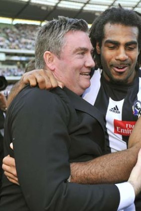Eddie McGuire and Harry O'Brien in happier times after Collingwood won the 2010 premiership.