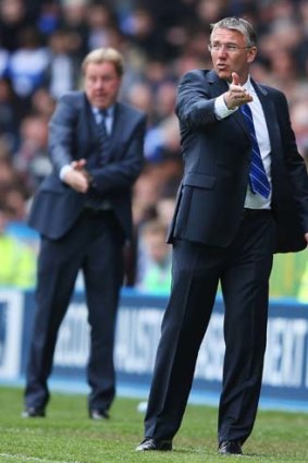That sinking feeling: Reading manager Nigel Adkins, right and QPR's Harry Redknapp gesticulate in vain as both clubs were relegated from the English Premier League.