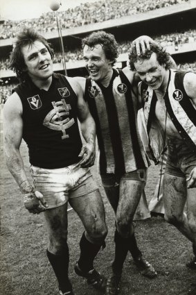 Wayne Harmes, Ken Sheldon and Jimmy Buckley (the latter pair having swapped guernseys) celebrate the 1979 grand final win.
