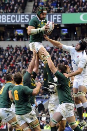 South Africa's Victor Matfield beats England's Tom Palmer in a lineout.