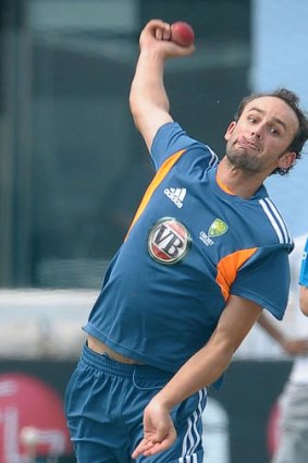 Australian cricketer Nathan Lyon delivers the ball during a practice session at the Galle International Stadium in Galle.