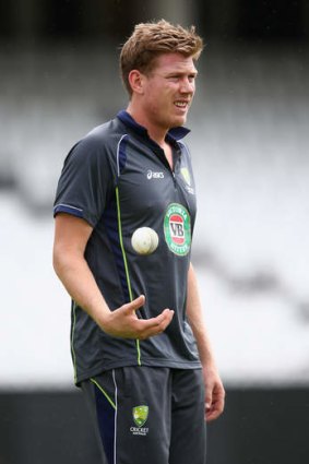 James Faulkner prepares to bowl during an Australia nets session in England.