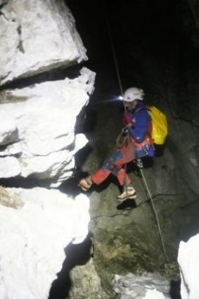 A rescuer enters a cave near Berchtesgaden, Germany.