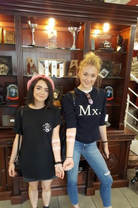 Sansa and Arya Stark show off their matching tattoos in Belfast, Northern Ireland.