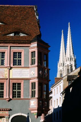 Town Hall Pharmacy at Untermarkt, and St Peter's Church towers.