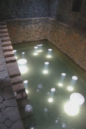 A subterranean stone room marks the rise and fall of the water table beneath Bijoy Jain's Tara House.