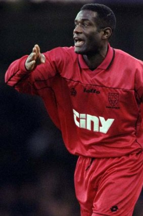 Sacked ... Robbie Earle, pictured here playing for Wimbledon.