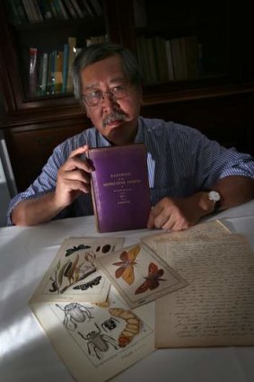 Professor Alan Yen with pages of pioneer researcher Charles French's handwritten guide to Victorian entomology.