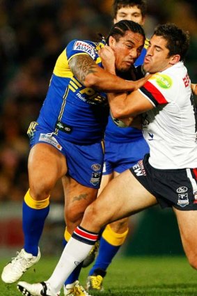 Dominant display . . . Braith Anasta gets to grips with Fuifui Moimoi during the Roosters' win at Parramatta Stadium last night.