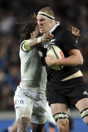 Brodie Retallick holds off Marland Yarde in the First Test.