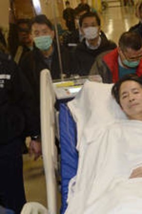 Former Ming Pao editor Kevin Lau, after he was attacked in the street with a meat cleaver.