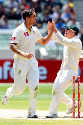 Captaincy material ... David Warner celebrates the wicket of Angelo Mathews with Mitchell Johnson during the second Test against Sri Lanka at the MCG.