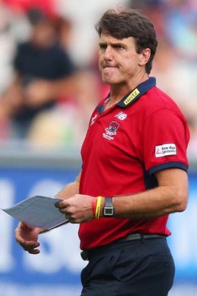 Demons coach Paul Roos watches his players being outplayed by the Eagles.