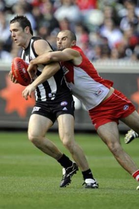 Sydney's Rhyce Shaw tackles former teammate Dane Swan, of Collingwood, in a game in 2009.