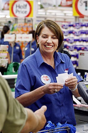 Premier job ... Anna Bligh works a day as a checkout operator.