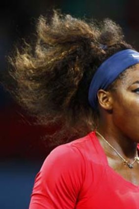 Hair-raising: Serena Williams celebrates her crushing win in the Brisbane International on Saturday night.