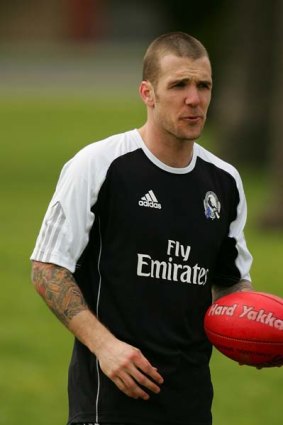 Dane Swan of the Magpies passes the ball during a  recovery session.