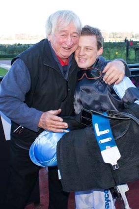 Jason Maskiell is congratulated by Vern Poke after winning the David Bourke Provincial Plate aboard The Cleaner at Flemington Racecourse on Saturday.