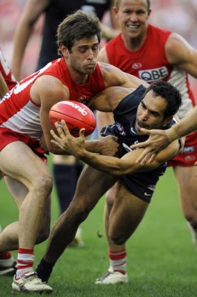 Carlton's Eddie Betts is tackled by Sydney's Nick Smith.