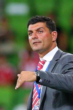 Heart coach John Aloisi gestures to a player from the sidelines during the match against Adelaide United.