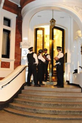 Police guard the front door of the Ecuadorian Embassy in London where Wikileaks founder Julian Assange is seeking political asylum.