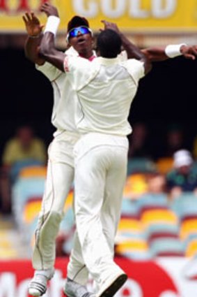 Off to a flyer ... Dwayne Bravo celebrates with paceman Jerome Taylor after he trapped opener Shane Watson lbw for a duck. The festivities were short-lived.