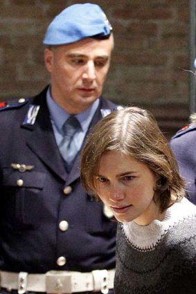 Amanda Knox is led into court during her first trial.