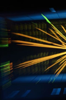 An image from the European Organization for Nuclear Research (CERN) in Geneva shows a representation with a zoom effect of traces of a proton-proton collision measured in the Compact Muon Solenoid (CMS) experience in the search for the Higgs boson.