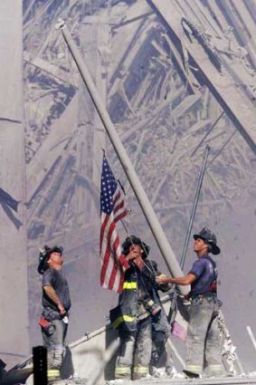 The famous picture of firefighters raising a US flag at the site shortly after the attacks.