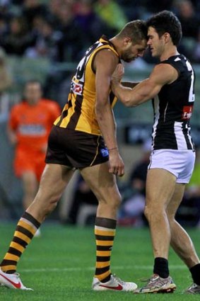 Buddy Franklin remonstrates with Magpies defender Chris Tarrant during the occasionally torrid qualifying final at the MCG. Tarrant has been encouraged to physically test his opponents again this week.