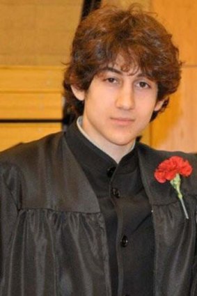 Dzhokhar Tsarnaev poses for a prom photo after graduating from high school.