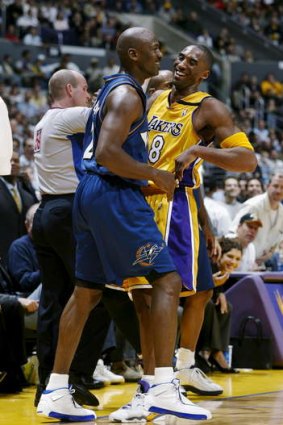 Michael Jordan and Kobe Bryant share a laugh after their collision.