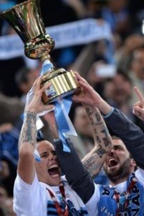 Napoli's midfielder Marek Hamsik (L) holds the trophy next to teammate Gonzalo Higuain after winning the Italian Tim Cup.