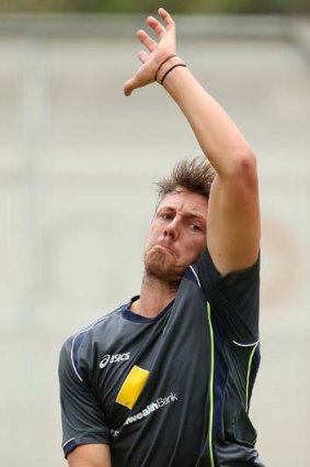 James Pattinson bends his back in the nets at the Gabba.