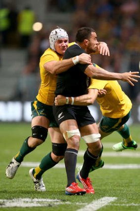 Liam Messam of the All Blacks offloads in the tackle of Ben Mowen last week.