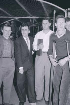 Injured Magpies at the 1960 VFL grand final. Thorold second from left with Bill Serong and Brian Dorman. Jockey Geoff Lane at left.