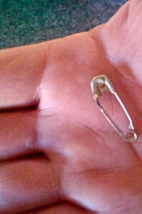 Patrick McMullen says he found this safety pin in a block of Woolworths cheese. 