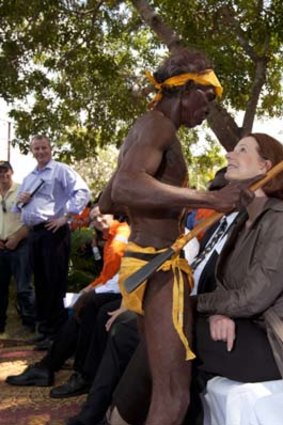 Julia Gillard with Yolngu dancer Timmy Ganambarr in the Gove Peninsula in north-east Arnhem Land yesterday.