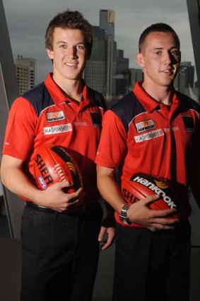 Win some, lose some: Jack Trengove, left, is still a Demon, while Tom Scully is captain of the Giants.