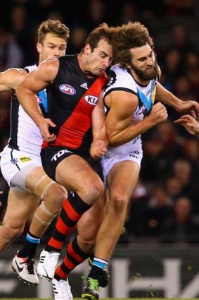 Crunch. A fair bump from Justin Westhoof puts Jobe Watson out of the game.