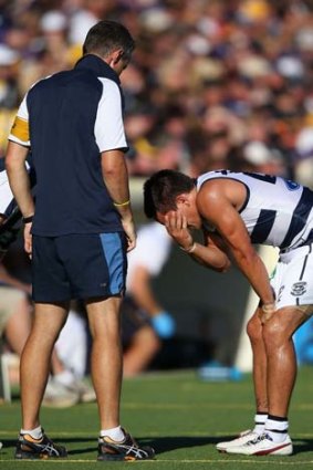 Not again: Mathew Stokes shows the pain of an ankle injury.