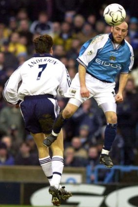 Danny Tiatto in action for Manchester City.