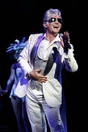 Todd McKenney glitters as Teen Angel, a role that's been reworked especially for him in the new touring production of <i>Grease</i>.
